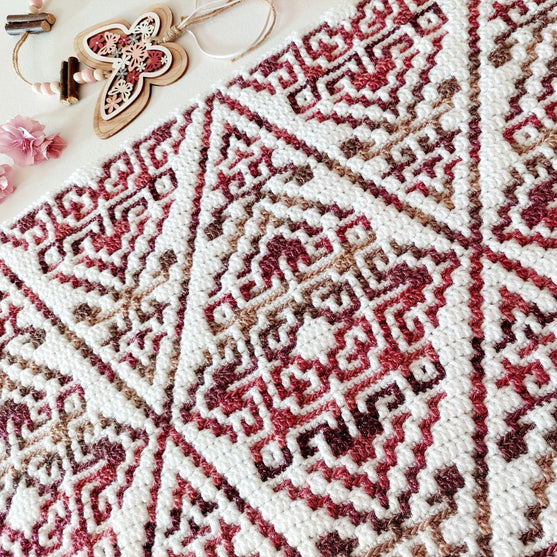 

Aztecana - Mosaikhæklet tæppe
5