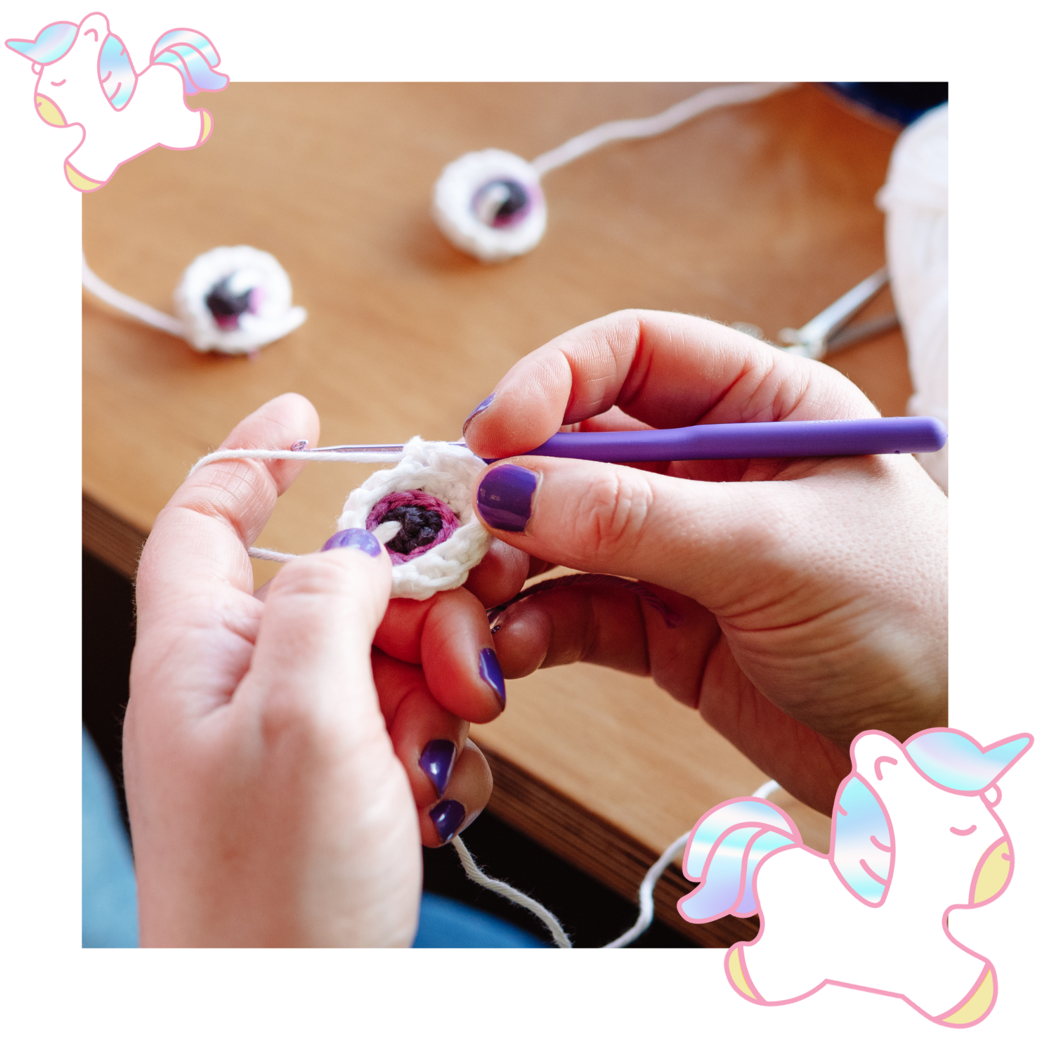 Hands crocheting a small decorative item with a wooden surface in the background