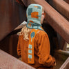 

Rust & Rhythm - Hættetørklæde
1